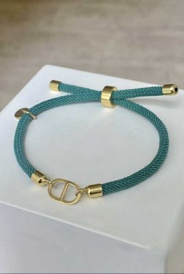 turquoise vergulde armband met koord en bedel fel groen