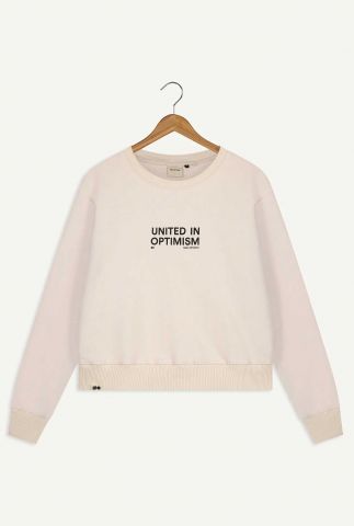 ecru kleurige sweater met tekst united in optimism geranio